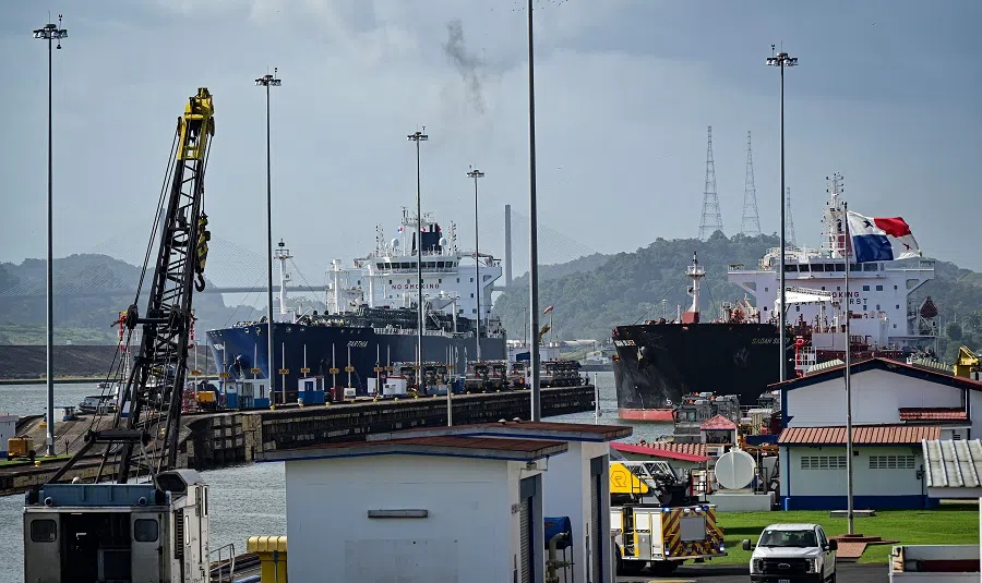Two cargo ships enter the Miraflores Locks of the Panama Canal in Panama City, Panama, on 22 January 2025. (Martin Bernetti/AFP)