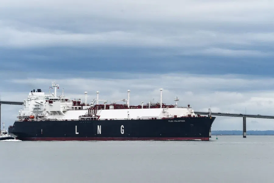 In this file photo taken on 12 April 2022 an LNG (liquefied natural gas) tanker cruises near the Saint-Nazaire bridge over the Loire estuary, as it leaves the dock of the LNG Terminal of Montoir-de-Bretagne, near Saint-Nazaire, western France. (Sebastien Salom-Gomis/AFP)
