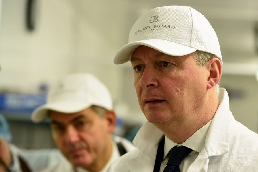 French Economy and Finance Minister Bruno Le Maire visits the French catering group Butard Enescot, 12 March 2020. He has commented that over-reliance on China needs to be reconsidered. (Eric Piermont/AFP)