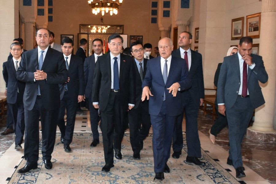 Arab League Secretary-General Ahmed Aboul-Gheit (centre right) welcomes Chinese Foreign Minister Qin Gang (centre left) and a delegation at the league's headquarters in Cairo, Egypt, on 15 January 2023. (AFP)