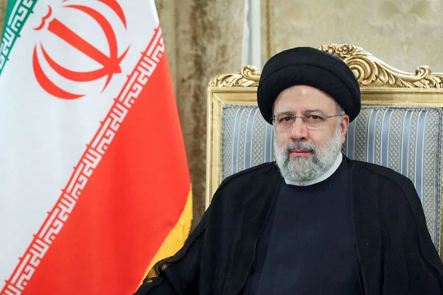 A handout picture provided by the Iranian presidency shows Iran's President Ebrahim Raisi meeting with Turkmenistan's president in Tehran, Iran, on 15 June 2022. (Iranian Presidency/AFP)