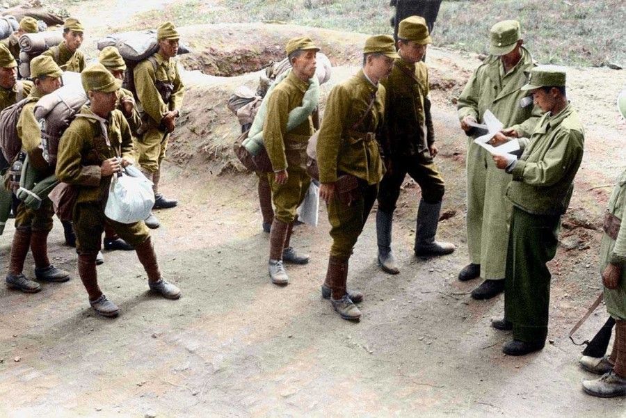 Japanese soldiers in areas around Nanjing being inspected by Chinese troops, as they prepare to be sent to concentration facilities, September 1945.