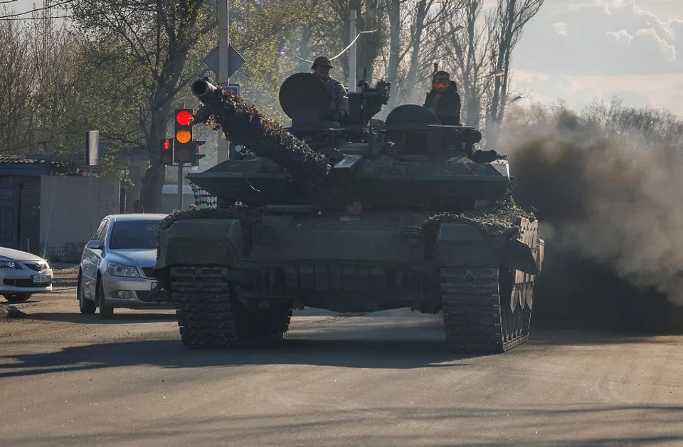 Russian army servicemen drive a tank on a street in Donetsk, Russian-controlled Ukraine on 6 April 2024. (Alexander Ermochenko/Reuters)