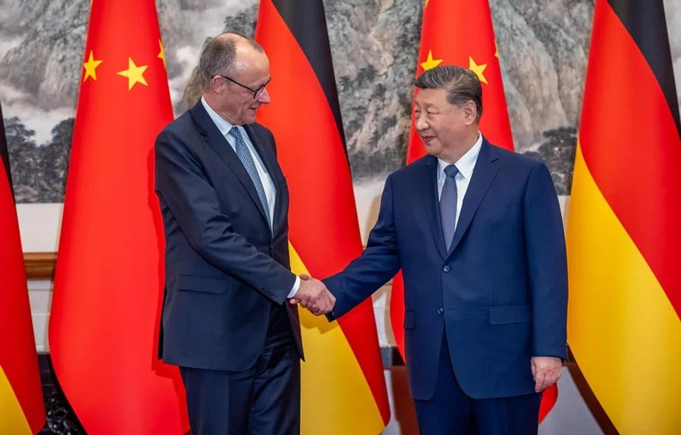 Chinese President Xi Jinping (right) shakes hands with German Chancellor Friedrich Merz prior a meeting at the Diaoyutai State Guesthouse in Beijing, China, on 25 February 2026. (Michael Kappeler/Pool/AFP)