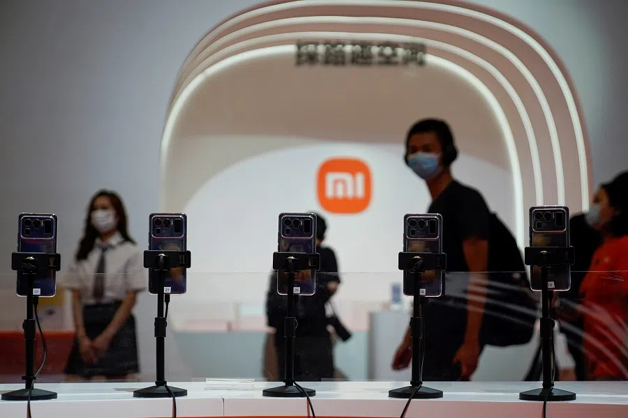 A view of mobile phones in front of the Xiaomi logo at the China Digital Entertainment Expo and Conference, also known as ChinaJoy, in Shanghai, China, 30 July 2021. (Aly Song/File Photo/Reuters)