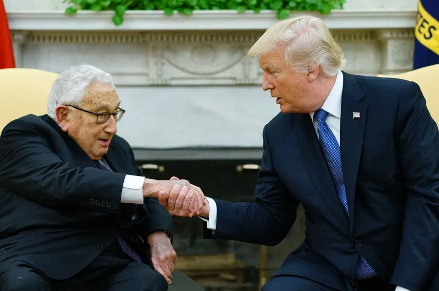 US President Donald Trump (right) shakes hands with former Secretary of State Henry Kissinger during their meeting in the Oval Office of the White House in Washington, DC, on 10 October 2017. (Mandel Ngan/AFP)