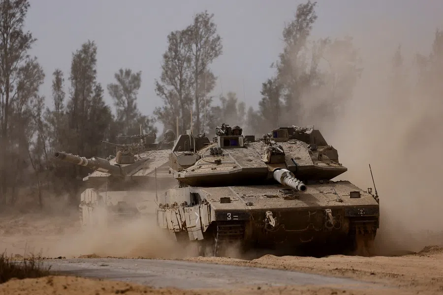 Tanks manoeuvre near the Israel-Gaza border, amid the ongoing conflict between Israel and the Palestinian Islamist group Hamas, in Israel, on 27 May 2024.  (Amir Cohen/Reuters)