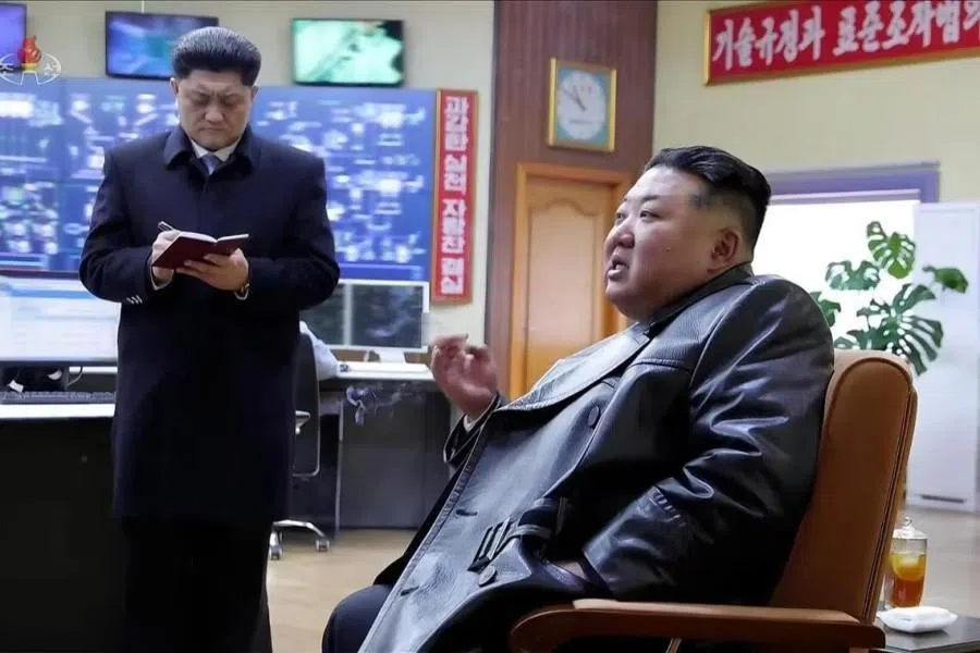A screen shot from a video showing Kim Jong Un smoking casually while inspecting the Sangwon Cement Complex in North Hwanghae province of North Korea. (Internet)