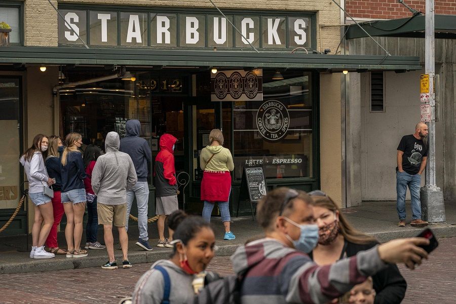 People gather near a popular Starbucks location on 10 June 2021 in Seattle, Washington, US. (David Ryder/Getty Images/AFP)