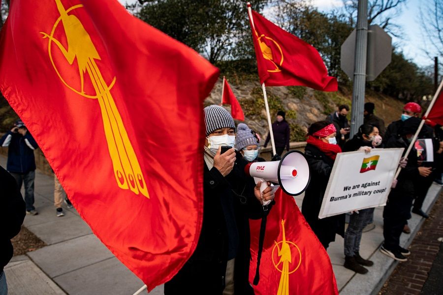 People protest against the military coup and to demand the release of elected leader Aung San Suu Kyi, outside of the Embassy of Myanmar in Washington, US, 9 February 2021. (Al Drago/Reuters)