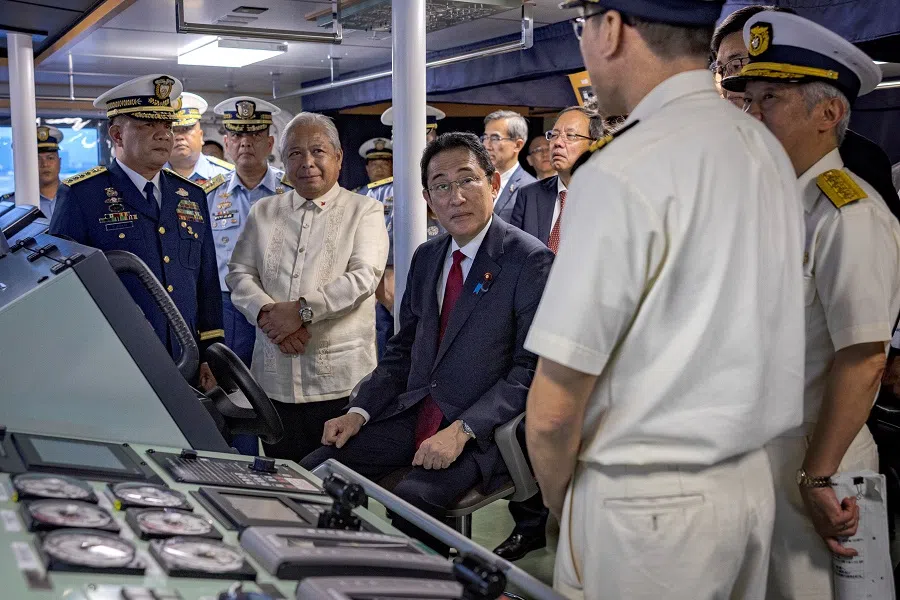Japan's Prime Minister Fumio Kishida sits at the bridge aboard the BRP Teresa Magbanua ship at the Philippine Coast Guard headquarters in Manila, the Philippines, on 4 November 2023. (Ezra Acayan/Pool via Reuters)