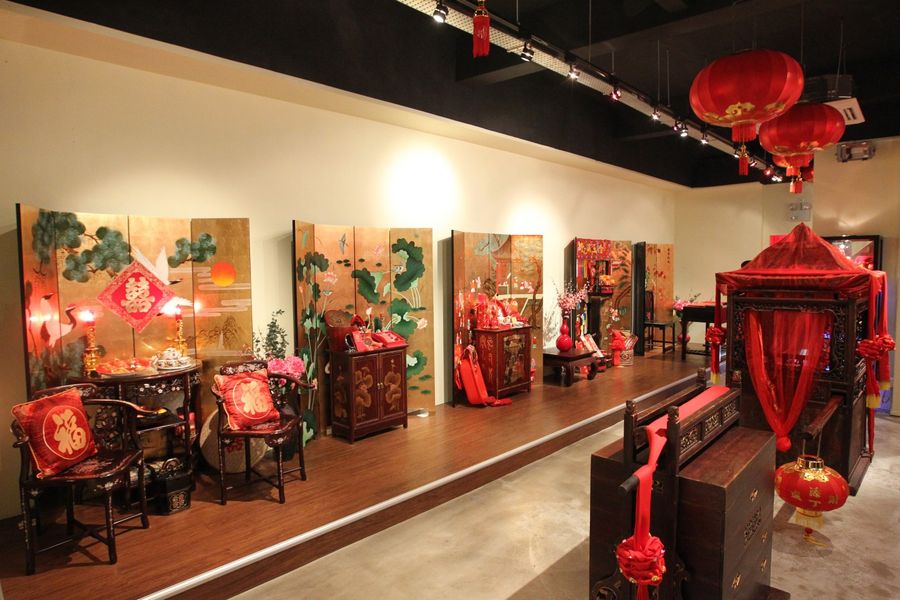 In a private museum at North Canal Road are exhibition pieces showcasing antique wedding decorations, including a Chinese wedding sedan chair. (SPH)