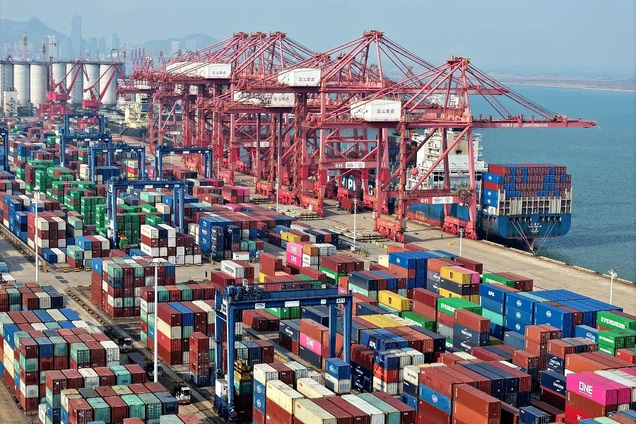 A container ship is loaded at the port in Lianyungang, Jiangsu province, China, on 10 December 2024. (AFP)