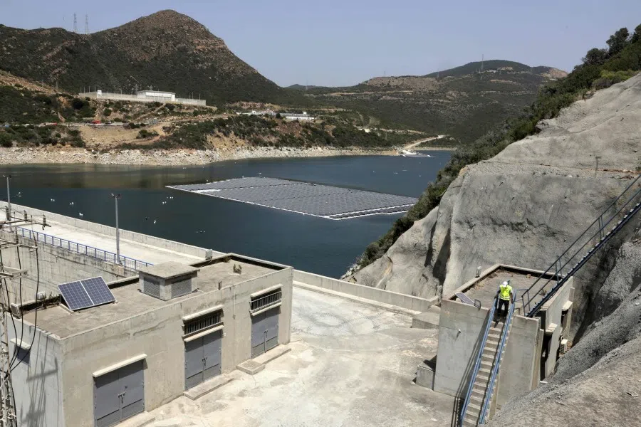 A view of the Oued Rmel dam where a photovoltaic solar installation floats, as part of a solar panel farm near the Tanger Med port in the province of Fahs-Anjra, west of the city of Tangiers, Morocco, on 7 August 2025. (Abdel Majid Bziouat/AFP)
