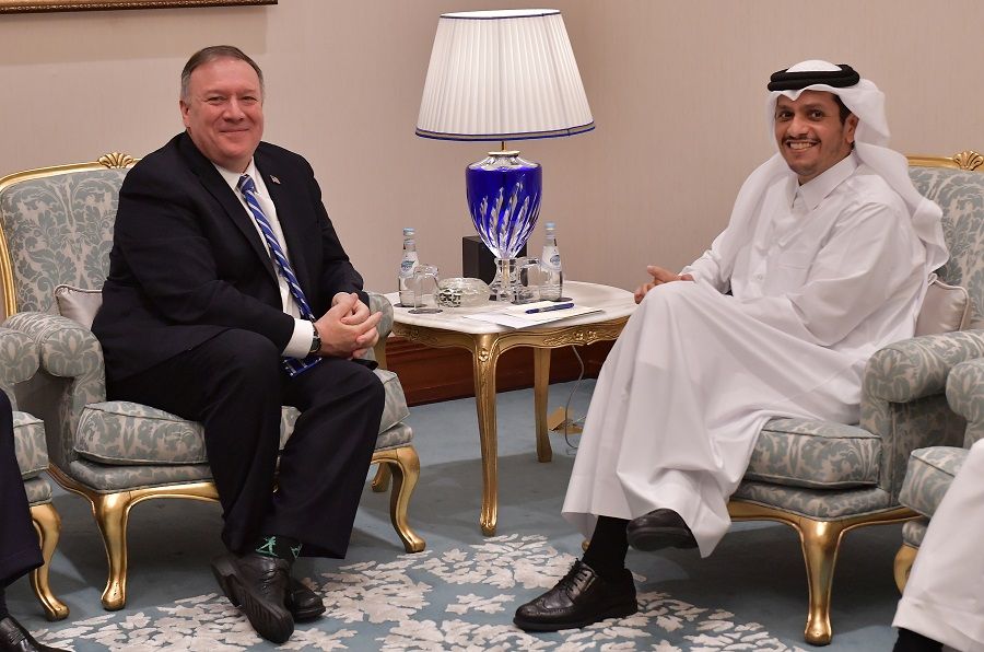 Qatari Deputy Prime Minister and Minister of Foreign Affairs Sheikh Mohammed bin Abdulrahman al-Thani meets with US Secretary of State Mike Pompeo on the sidelines of the peace signing ceremony between the United States and Afghanistan's Taliban in Doha, Qatar, on 29 February 2020. (Giuseppe Cacace/Pool via Reuters)