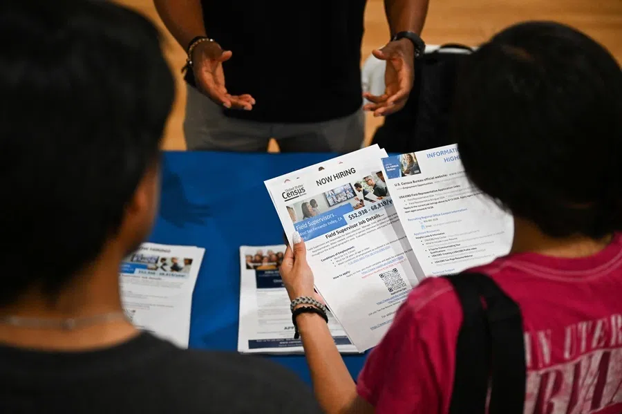 A job seeker looks at a US Census Bureau now hiring flyer about jobs with the US Federal government in Los Angeles, California, on 29 July 2026.
