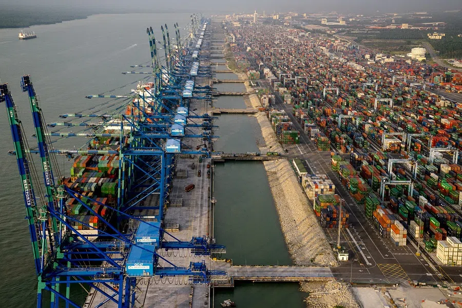 Container ships sit docked next to gantry cranes at Port Klang in this aerial photograph taken over Klang district, Selangor, Malaysia, on 9 January 2016. (Sanjit Das/Bloomberg)