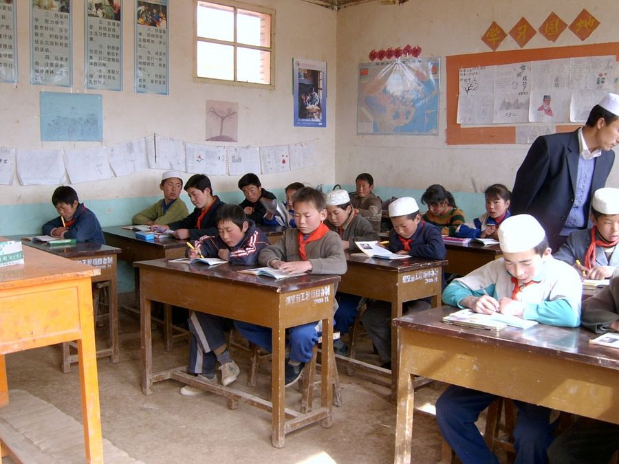 Fifth graders attending class in Daping village's only school. Only a dozen or so of the students from this school in Gansu province have made it to high school. No one has ever gone to college. (Photo: Tschang Chi-chu)