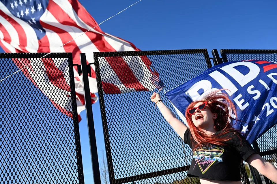 A supporter of President-elect Joe Biden celebrate his victory in Wilmington, Delaware on 7 November 2020. (Jim Watson/AFP)