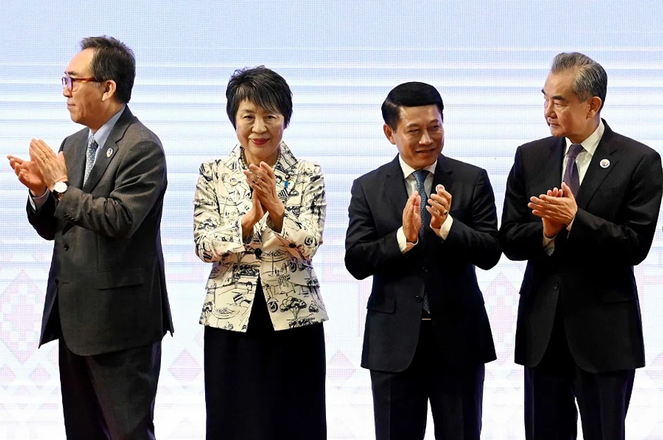South Korea’s Foreign Minister Cho Tae-yul (left), Japan’s Foreign Minister Yoko Kamikawa (second from left), Laos’ Foreign Minister Saleumxay Kommasith (second from right) and China’s Foreign Minister Wang Yi (right) after a group photo during the 25th ASEAN Plus Three Foreign Ministers’ Meeting at the 57th Association of Southeast Asian Nations (ASEAN) Foreign Ministers’ Meeting in Vientiane on 27 July 2024. (Tang Chhin Sothy/AFP)