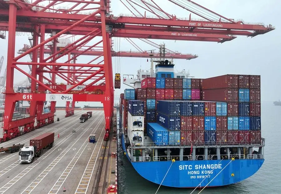 A ship full of containers is seen at the container terminal in Lianyungang, Jiangsu province, China, on 24 March 2026. (CN-STR/AFP)