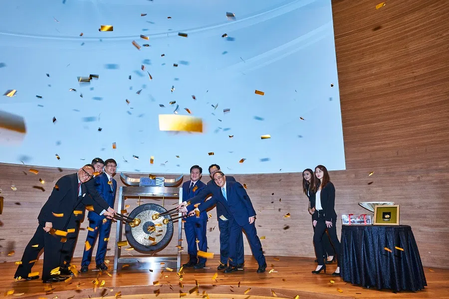 Yangzijiang Shipbuilding celebrated its 10th anniversary as a Singapore-listed company in 2017. Ren Yuanlin (third from left) is seen in this photograph with his son, Ren Letian (second from left). (Yangzijiang Shipbuilding)