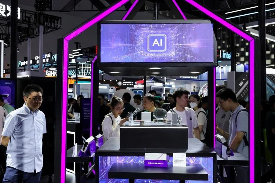 FILE PHOTO: People visit a Metax booth during the World Artificial Intelligence Conference in Shanghai, China July 26, 2025. REUTERS/Go Nakamura/File Photo