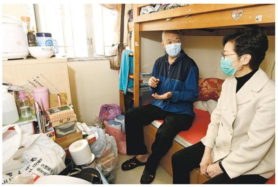 Hong Kong Chief Executive Carrie Lam visiting a subdivided flat, February 2020. (SPH/Internet)