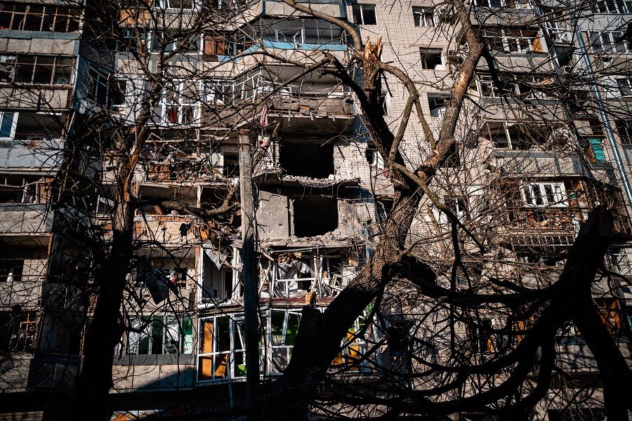 This photograph taken on 20 December 2022 shows a residential building damaged by Russian shelling in Kherson, Ukraine, amid the Russian invasion of Ukraine. (Dimitar Dilkoff/AFP)