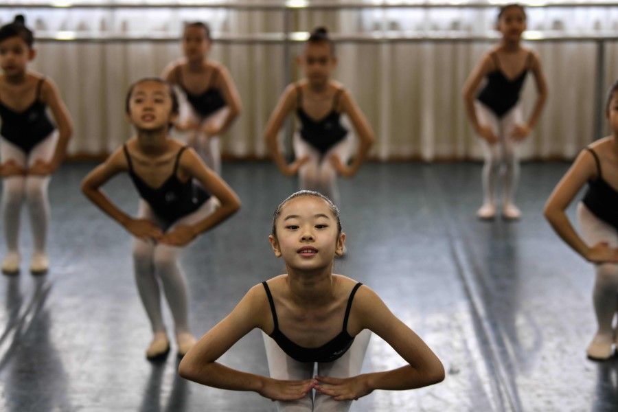 Students attend to their dance class in Changchun Street Primary School in Wuhan, China's central Hubei province, on 4 September 2020. (Hector Retamal/AFP)