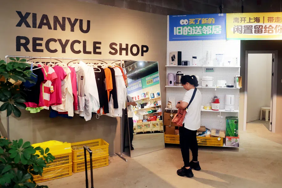 A customer shops at the newly opened Xianyu recycle shop in Shanghai, China, on 9 August 2024. 