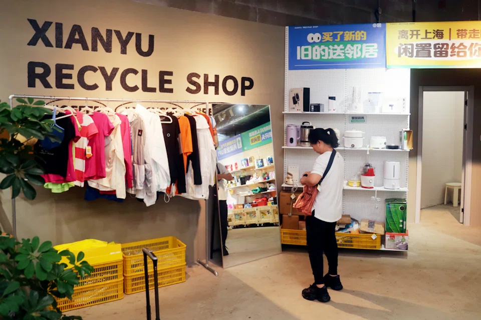 A customer shops at the newly opened Xianyu recycle shop in Shanghai, China, on 9 August 2024.  (CFOTO/Sipa USA via Reuters)