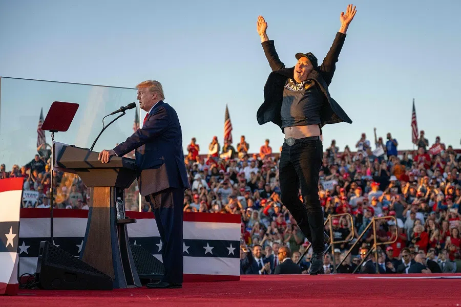 Tesla CEO Elon Musk jumps on stage as he joins US President Donald Trump during a campaign rally at the site of his first assassination attempt in Butler, Pennsylvania, on 5 October 2024. (Jim Watson/AFP)