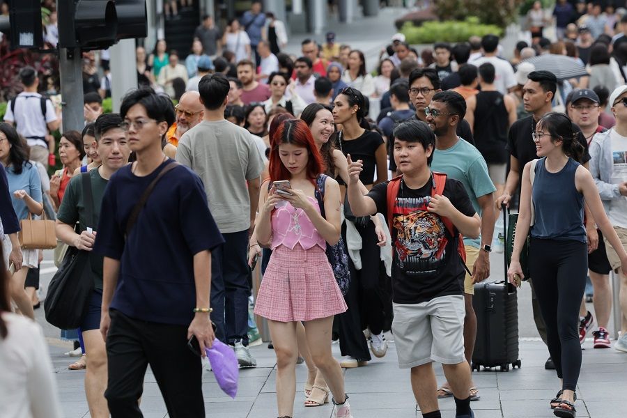 People walk along Orchard Road in Singapore on 9 March 2024. (SPH Media)