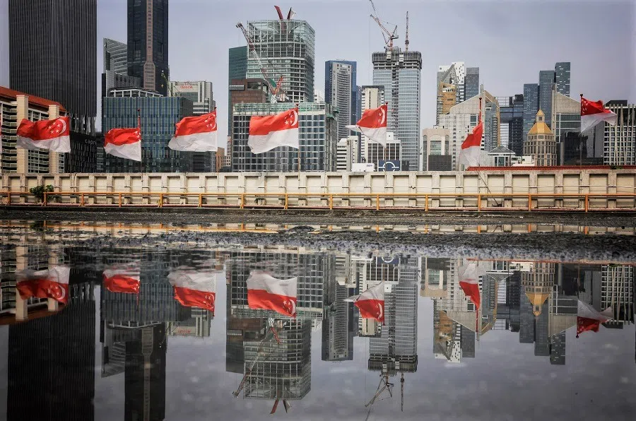 Singapore flags seen adorning the rooftop carpark of People's Park Complex in Chinatown, Singapore, 28 July 2023. (SPH Media)
