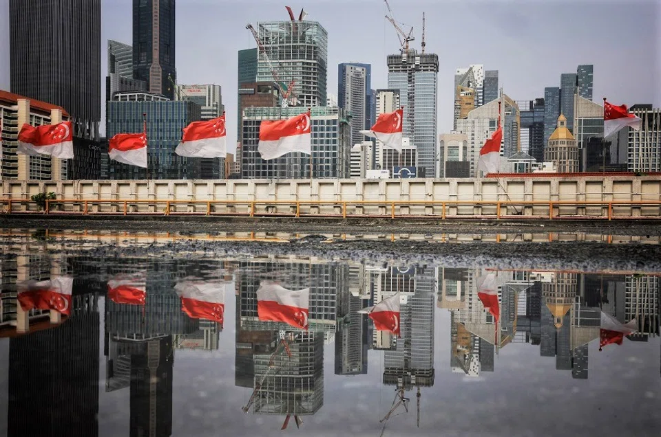 Singapore flags seen adorning the rooftop carpark of People's Park Complex in Chinatown, Singapore, 28 July 2023. (SPH Media)