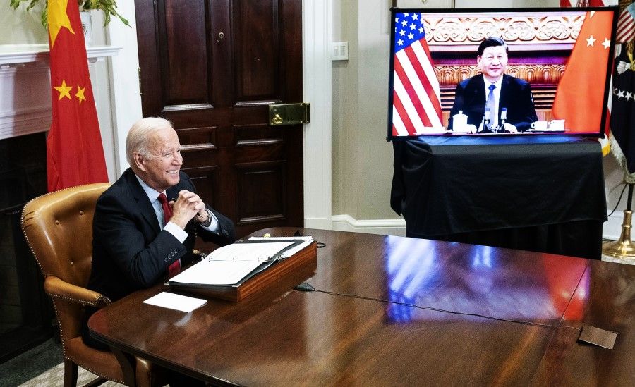 US President Joe Biden reacts while meeting virtually with Chinese President Xi Jinping in the Roosevelt Room of the White House in Washington, DC, US, on 15 November 2021. (Sarah Silbiger/Bloomberg)