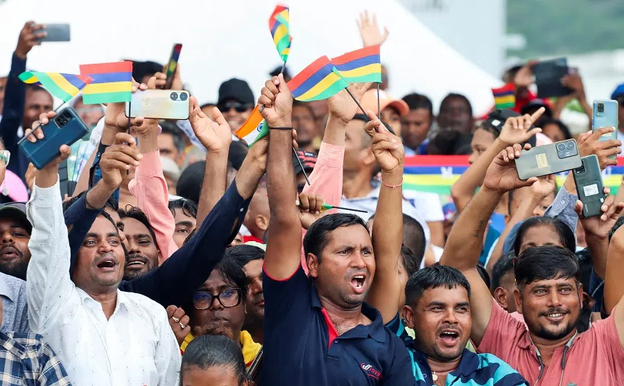 People cheer as they attend Mauritius’ 57th National Day celebrations at the Champ De Mars, Port Louis, Mauritius, on 12 March 2025. (Ally Soobye/Reuters)