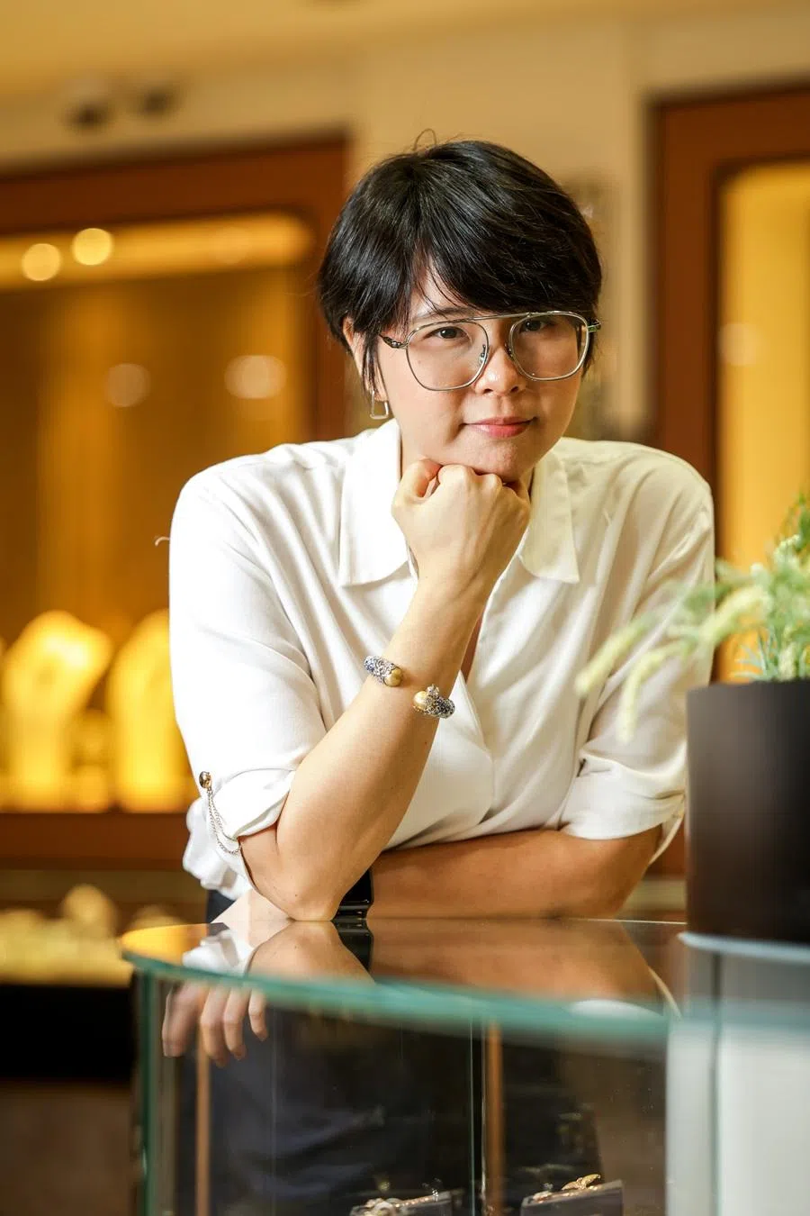 Jenny Grace Johnson, senior jewellery designer at On Cheong, poses with one of her favourite designs. (Jonathan Yeap/SPH Media)