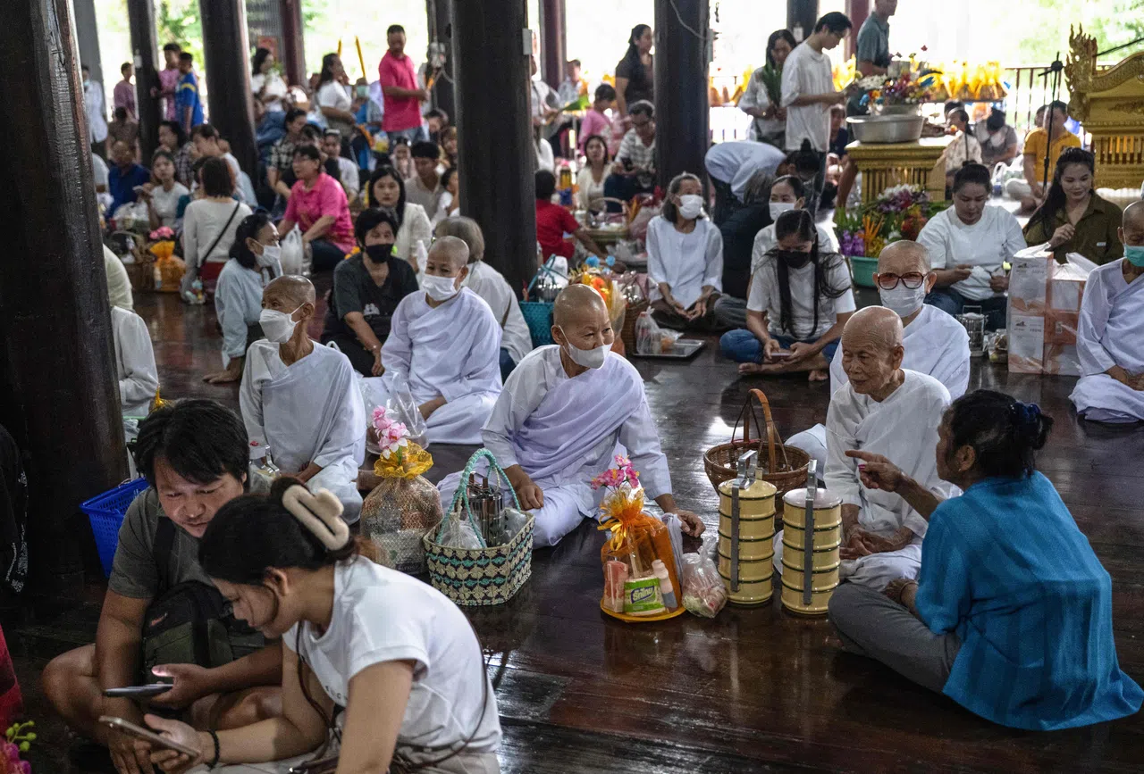 People gather to mark the start of Buddhist Lent at Wat Nong Song Hong Buddhist temple in Samut Sakhon province on 30 July 2026.