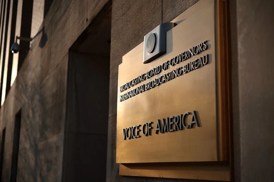 The Voice of America (VOA) sign is displayed on its building on 17 March 2025 in Washington, DC. (Alex Wong/Getty Images via AFP)