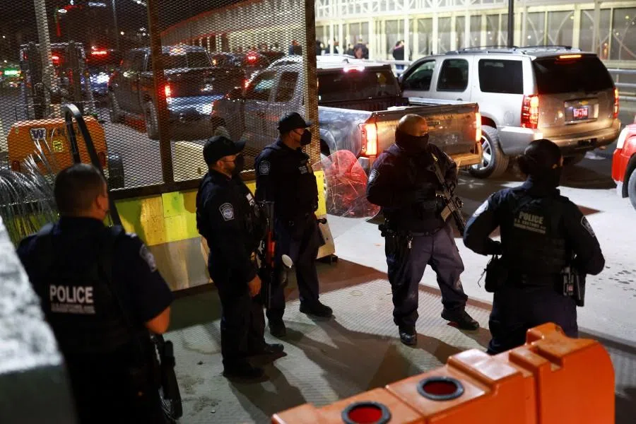 U.S. Customs and Border Protection agents stand guard at the Paso del Norte International Bridge, ​​after the US struck Venezuela and captured its President Nicolas Maduro and his wife Cilia Flores, as seen from Ciudad Juarez, Mexico, on 3 January 2026. (Jose Luis Gonzalez/Reuters)