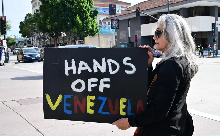 Activists gather to protest against US President Donald Trump's recent action in Venezuela on 6 January 2026, in Pasadena, California, US. (Frederic J. Brown/AFP)