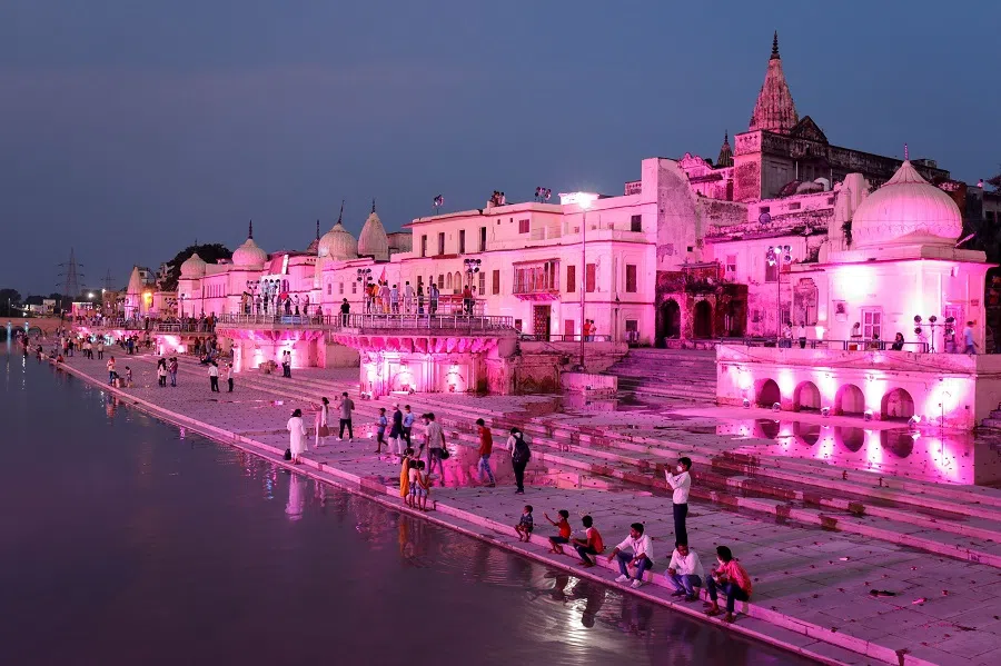 Temples and other buildings on the bank of Sarayu river are seen illuminated ahead of the foundation-laying ceremony for a Hindu temple in Ayodhya, India, 4 August 2020. (Pawan Kumar/Reuters)
