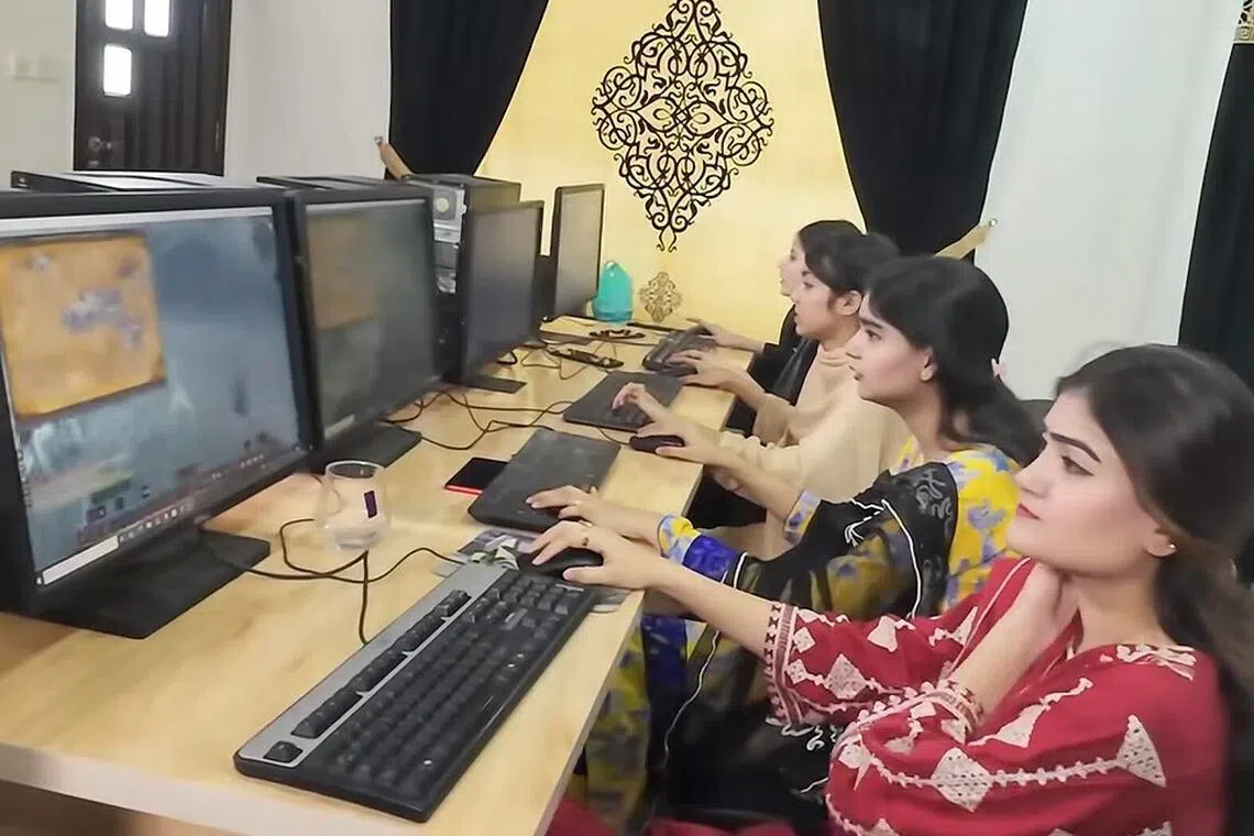 Employees work at a gaming studio in Pakistan.