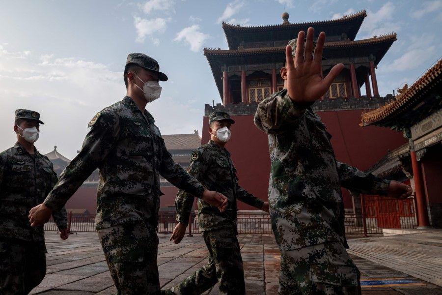 People's Liberation Army (PLA) soldiers march next to the entrance to the Forbidden City during the opening ceremony of the Chinese People's Political Consultative Conference (CPPCC) in Beijing, 21 May 2020. (Nicolas Asfouri/AFP)