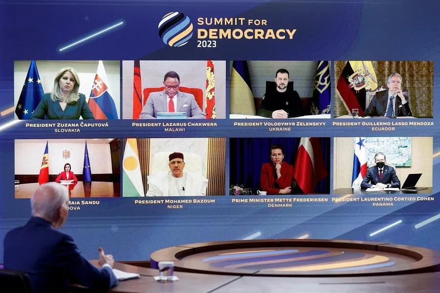 Participants are seen on the screen as US President Joe Biden delivers remarks during a virtual Summit for Democracy, which he is hosting from an auditorium on the White House campus in Washington, US, 29 March 2023. (Jonathan Ernst/Reuters)