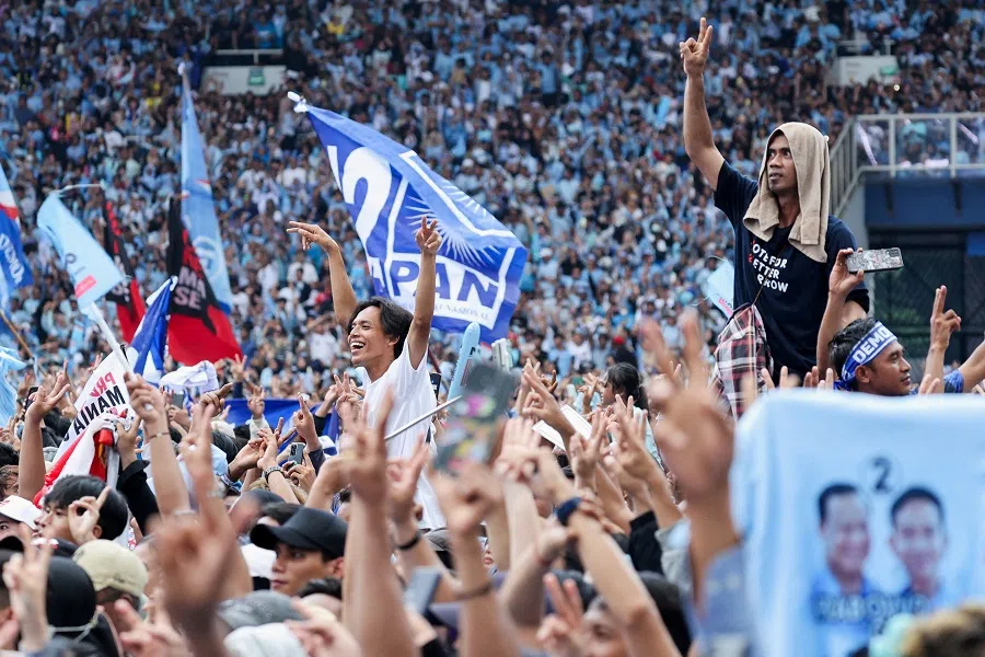 Supporters of Indonesia’s Defence Minister and presidential candidate Prabowo Subianto and his running mate Gibran Rakabuming Raka, react at their campaign rally in Jakarta, Indonesia, on 10 February 2024. (Kim Kyung-Hoon/Reuters)