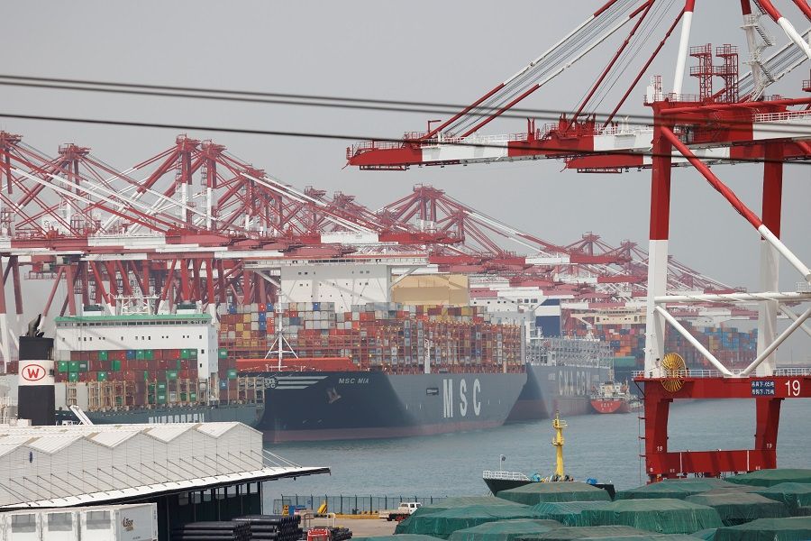 Container ships are seen at the Port of Qingdao in Shandong province, China, 28 April 2021. (Carlos Garcia Rawlins/File Photo/Reuters)