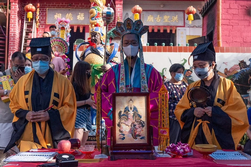 Priests chant scriptures during a ceremony at a temple in Hong Kong on 21 August 2021, marking the Hungry Ghost Festival. (Bertha Wang/AFP)